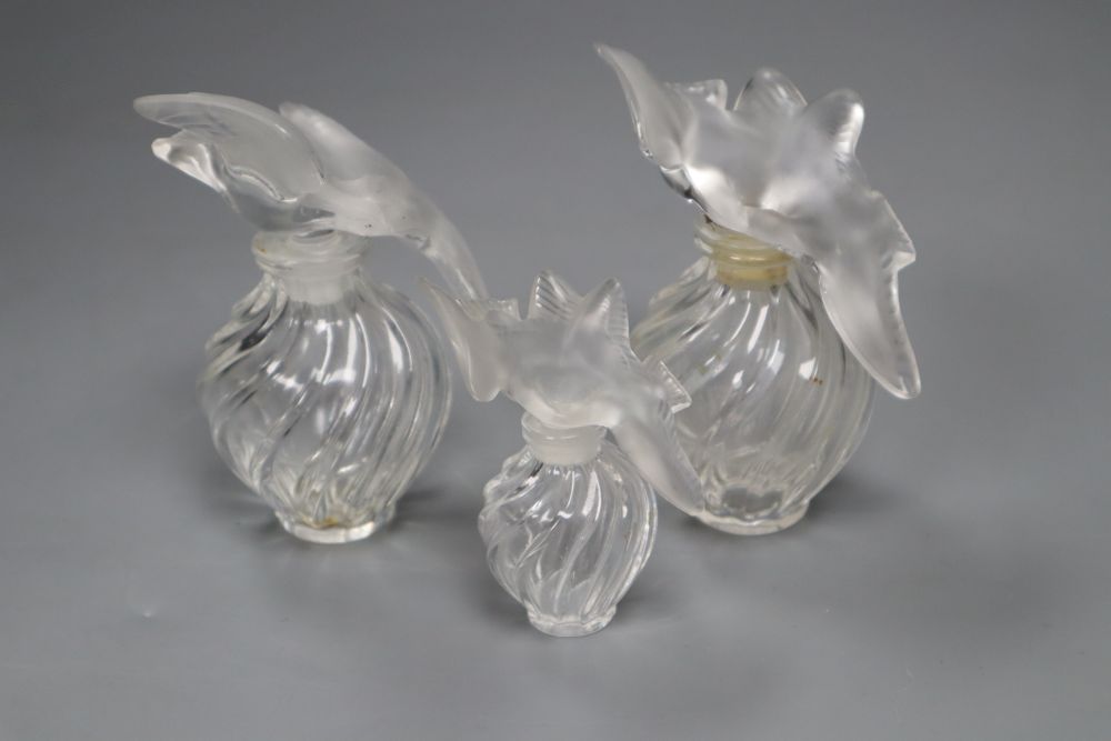 Three Lalique Nina Ricci LAir du Temps perfume bottles, signed, two height 11cm, one 8cm